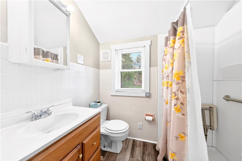 607 Cemetery Road Perryopolis, PA 15473 - Photo 15 of 30 a bath room with a sink toilet and a mirror