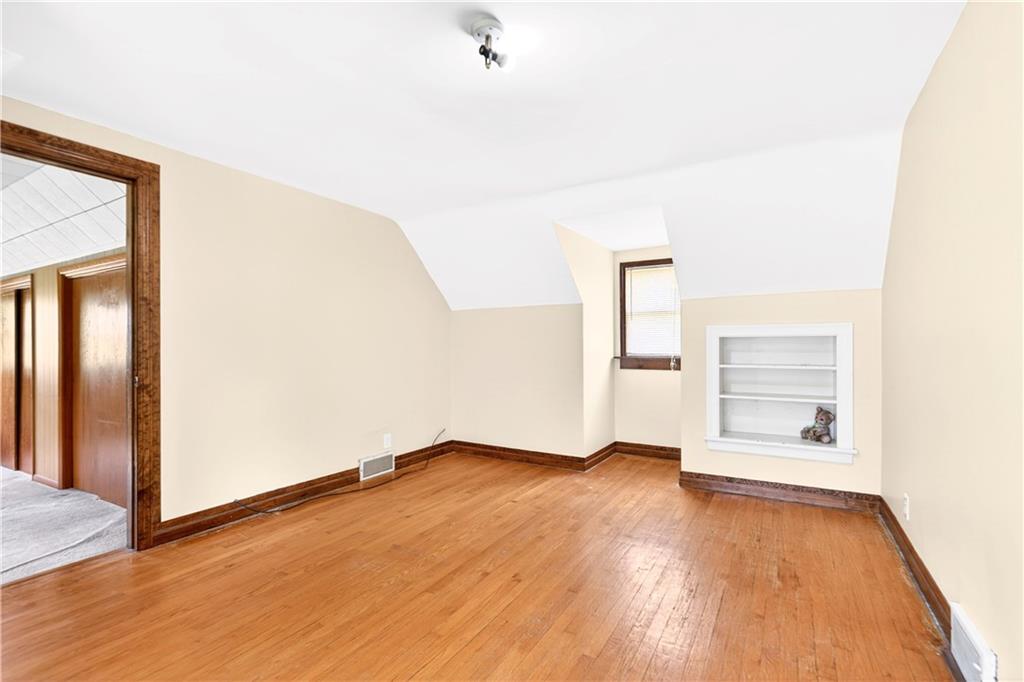607 Cemetery Road Perryopolis, PA 15473 - Photo 20 of 30 a view of an empty room with wooden floor and a window