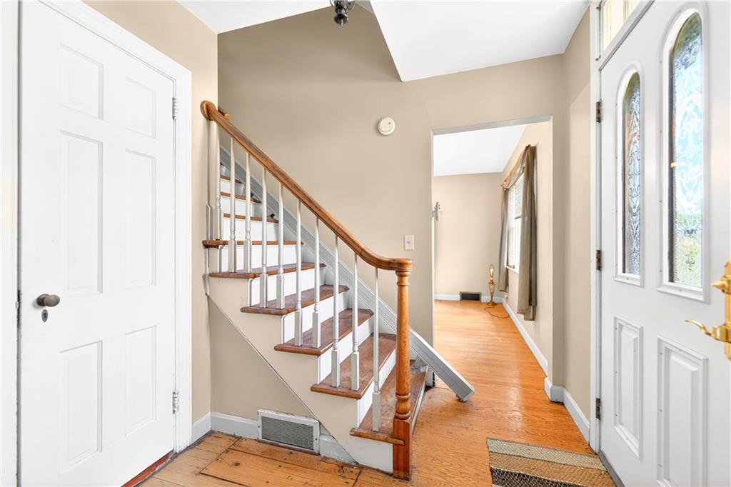 607 Cemetery Road Perryopolis, PA 15473 - Photo 2 of 30 a view of an entryway with wooden floor and stairs