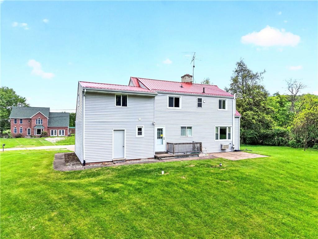 607 Cemetery Road Perryopolis, PA 15473 - Photo 24 of 30 a view of a house with a yard porch and sitting area