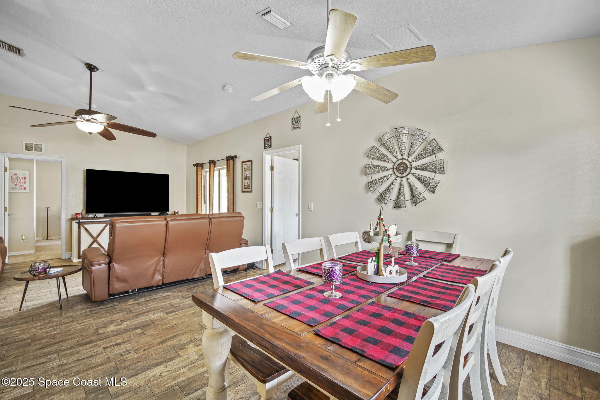 3356 Kilbee Street Mims, FL 32754 - Photo 8 of 28 a view of a dining room with furniture and wooden floor