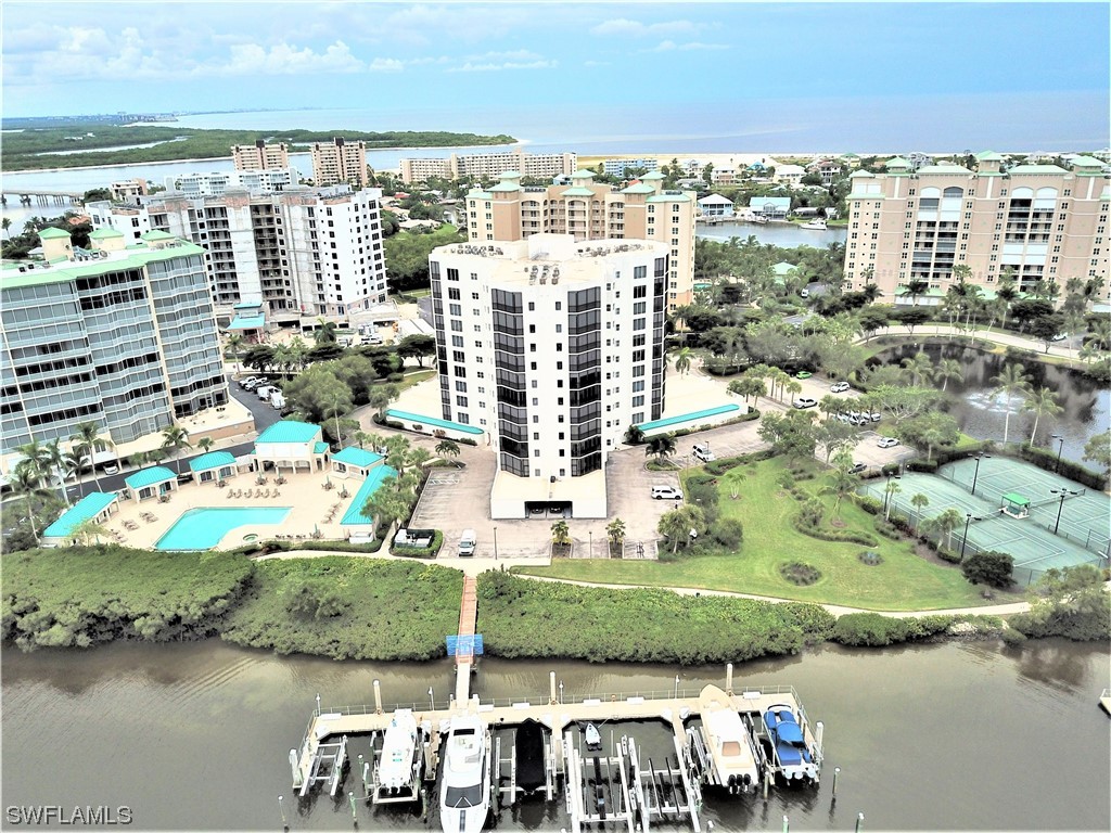an aerial view of residential building with outdoor space and lake view