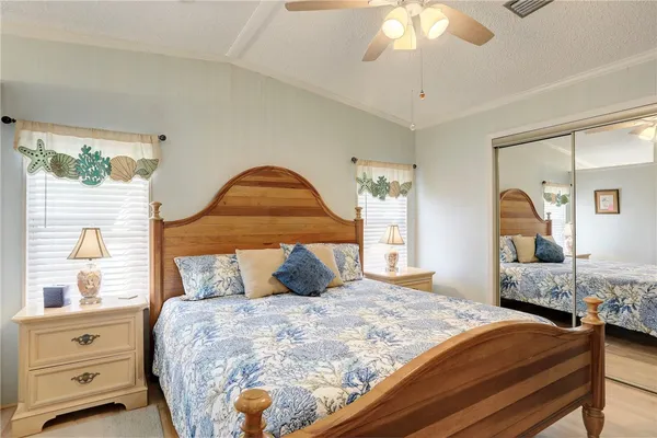 a bathroom with a double vanity sink mirror and shower