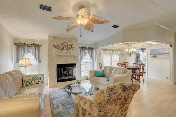 a dining room with furniture and window