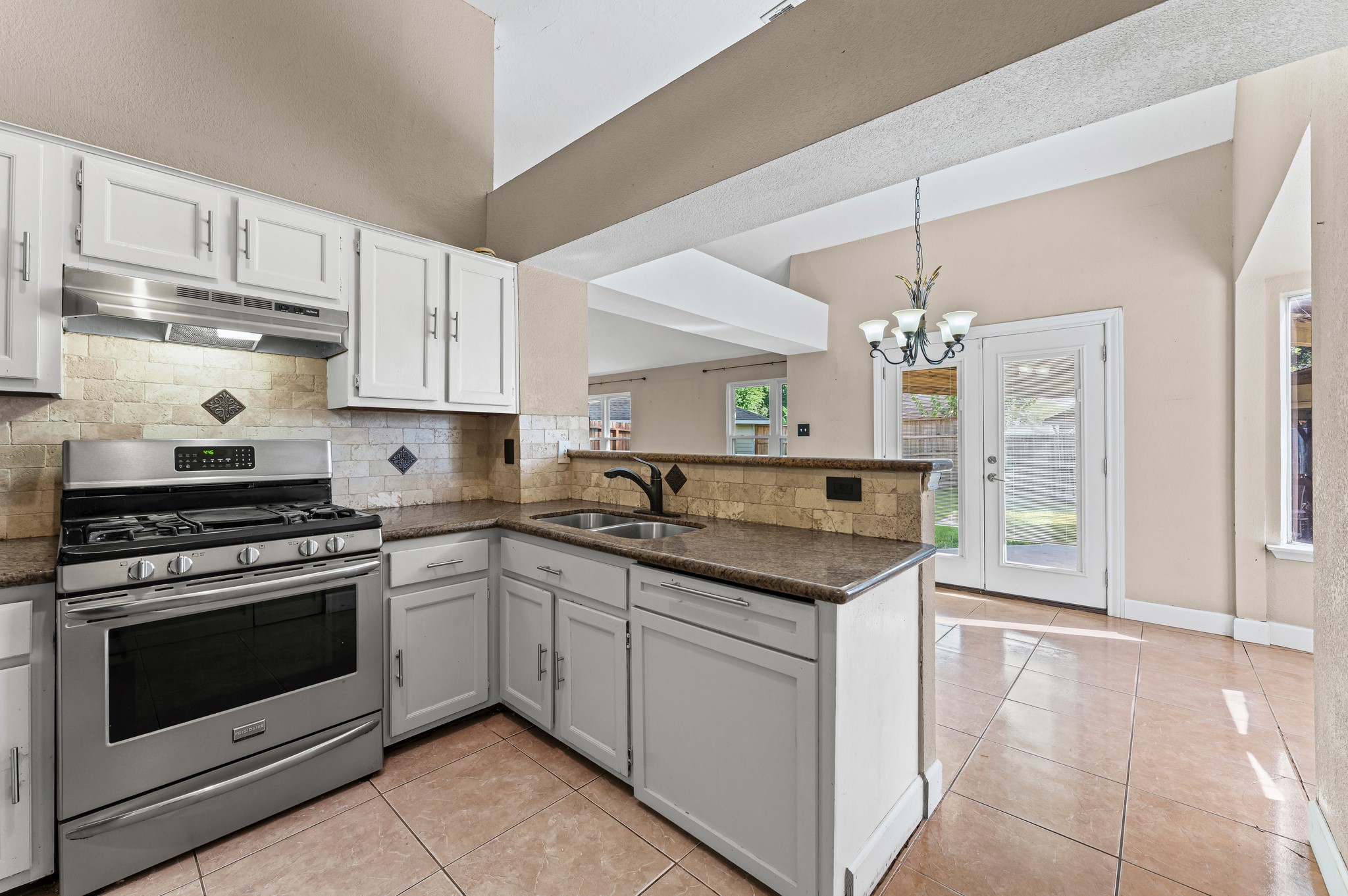 1034 Little Port Channelview, TX 77530 - Photo 12 of 21 a kitchen with stainless steel appliances granite countertop a stove and a sink