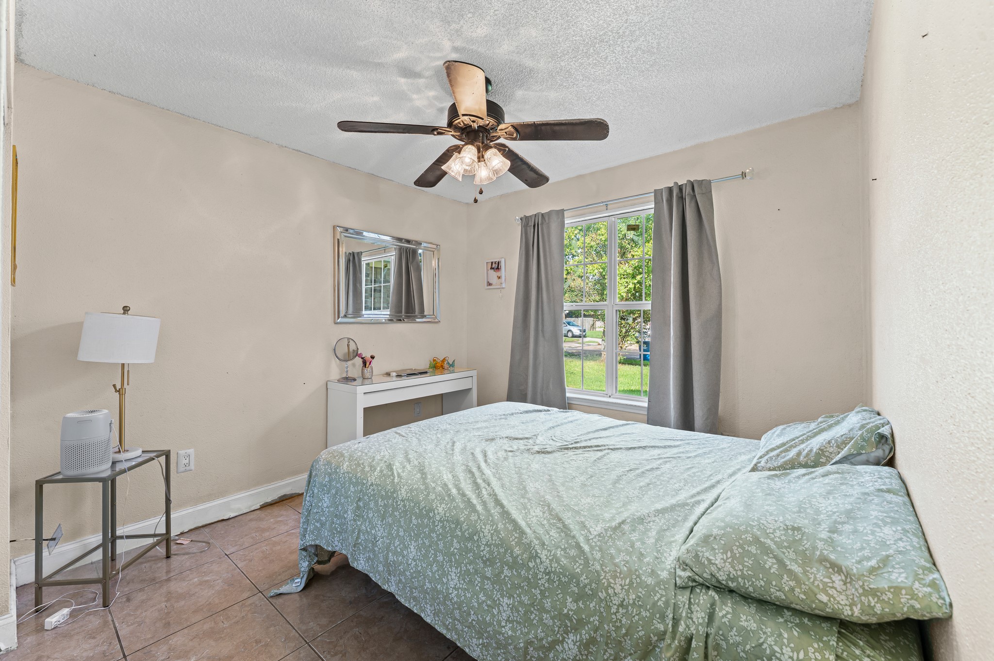 1034 Little Port Channelview, TX 77530 - Photo 16 of 21 a bedroom with a bed and a chandelier