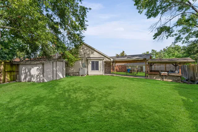 a front view of house with yard and seating area