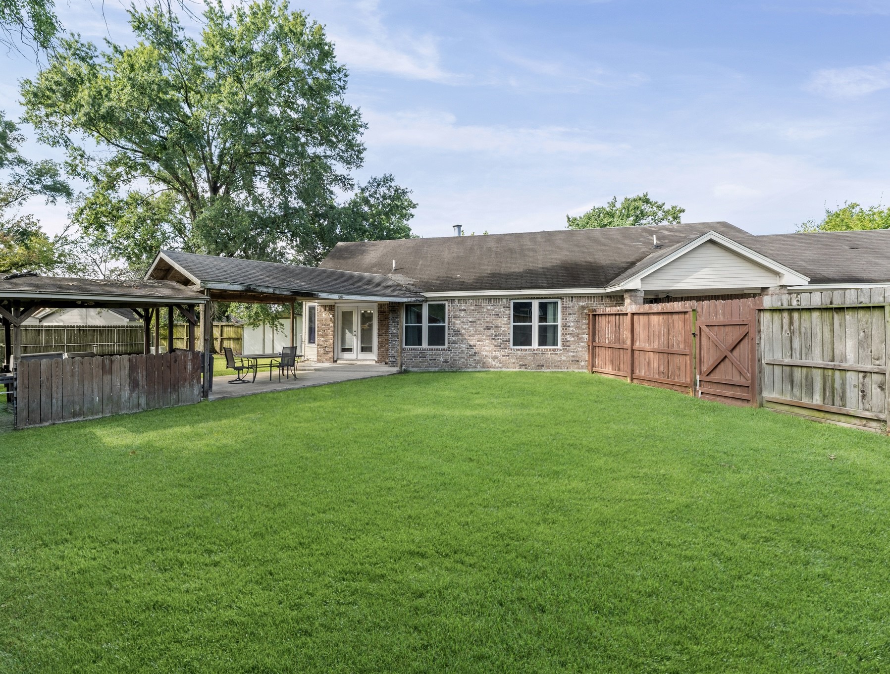 1034 Little Port Channelview, TX 77530 - Photo 20 of 21 a view of a house with a yard and sitting area