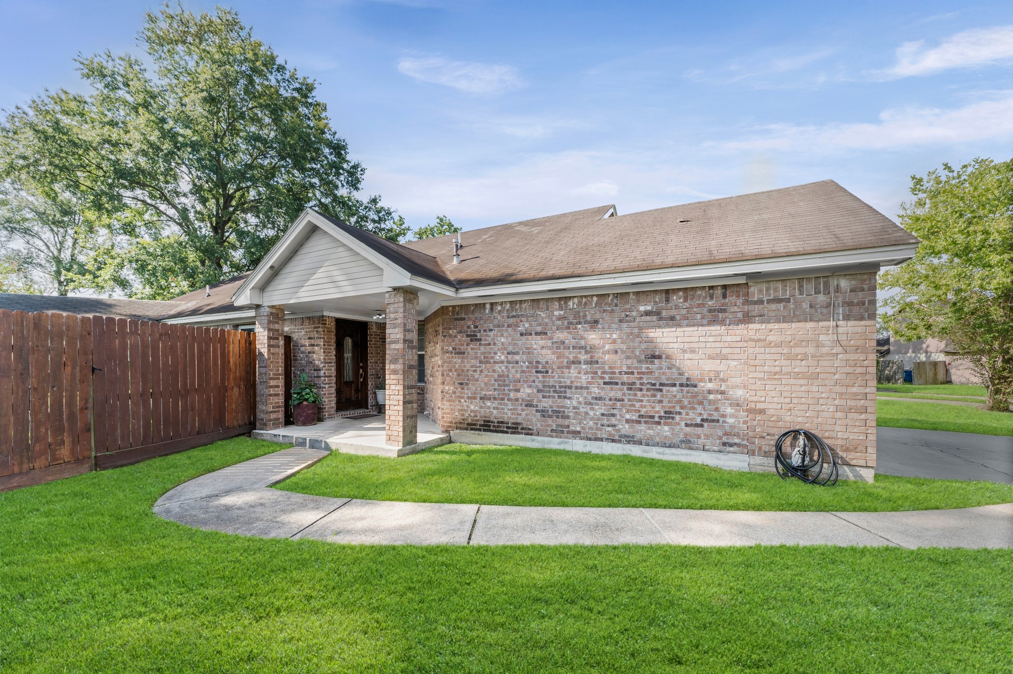 1034 Little Port Channelview, TX 77530 - Photo 4 of 21 a front view of a house with a yard and garage