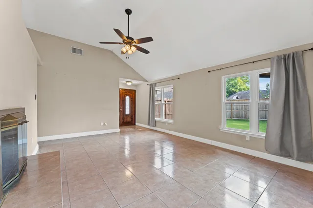 a view of an empty room with a window