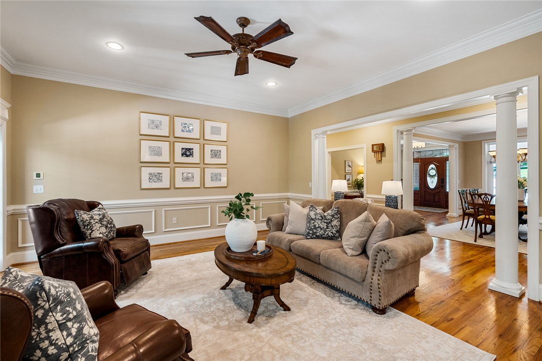 200 Graylyn Drive Anderson, SC 29621 - Photo 9 of 48 Hardwood floors and crisp crown molding frame this inviting living space, offering an open flow into adjacent rooms.