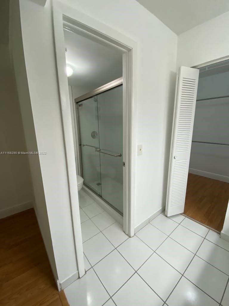 6320 Southwest 138th Court, Unit 308 Miami, FL 33183 - Photo 12 of 25 a bathroom with a shower and toilet