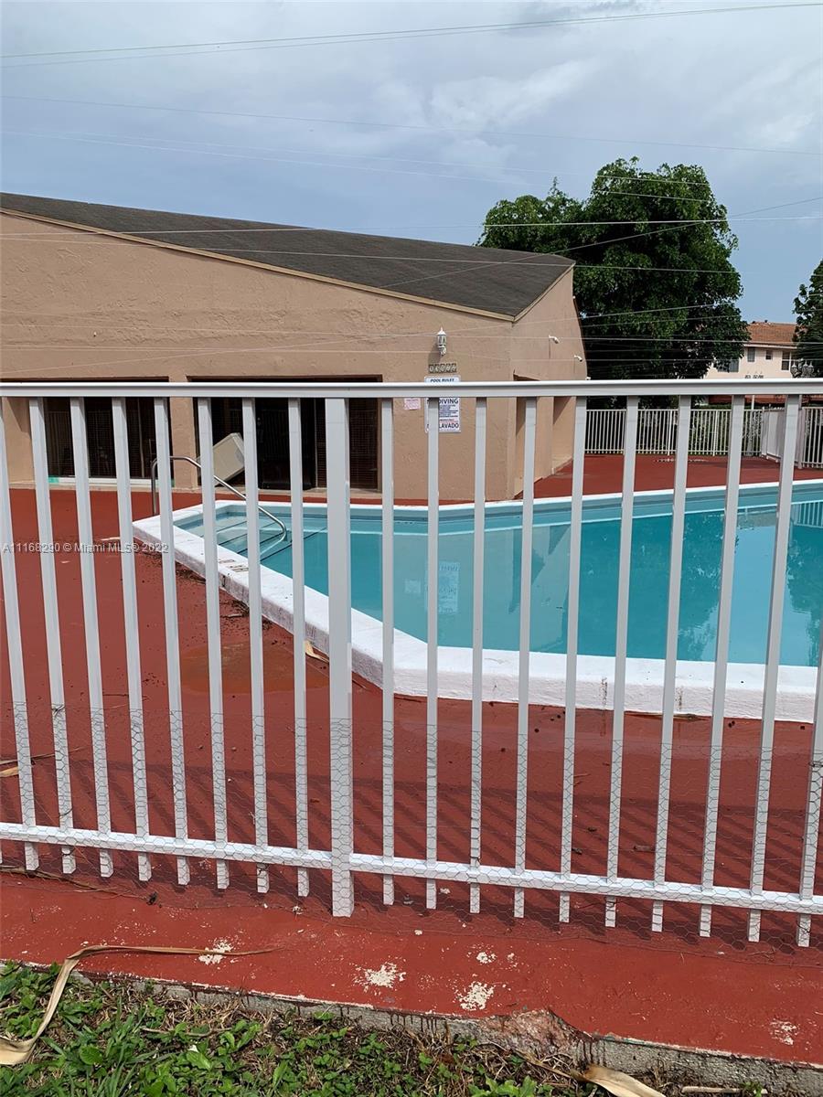 6320 Southwest 138th Court, Unit 308 Miami, FL 33183 - Photo 16 of 25 a view of a house with a yard