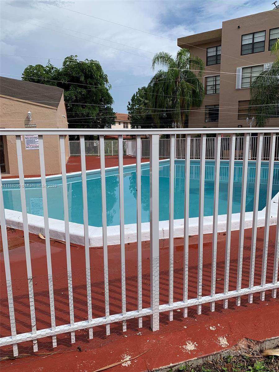 6320 Southwest 138th Court, Unit 308 Miami, FL 33183 - Photo 17 of 25 a view of a brick building from a street
