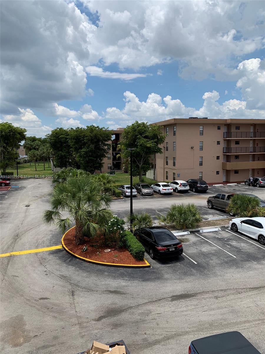 6320 Southwest 138th Court, Unit 308 Miami, FL 33183 - Photo 19 of 25 a view of a lake with outdoor space