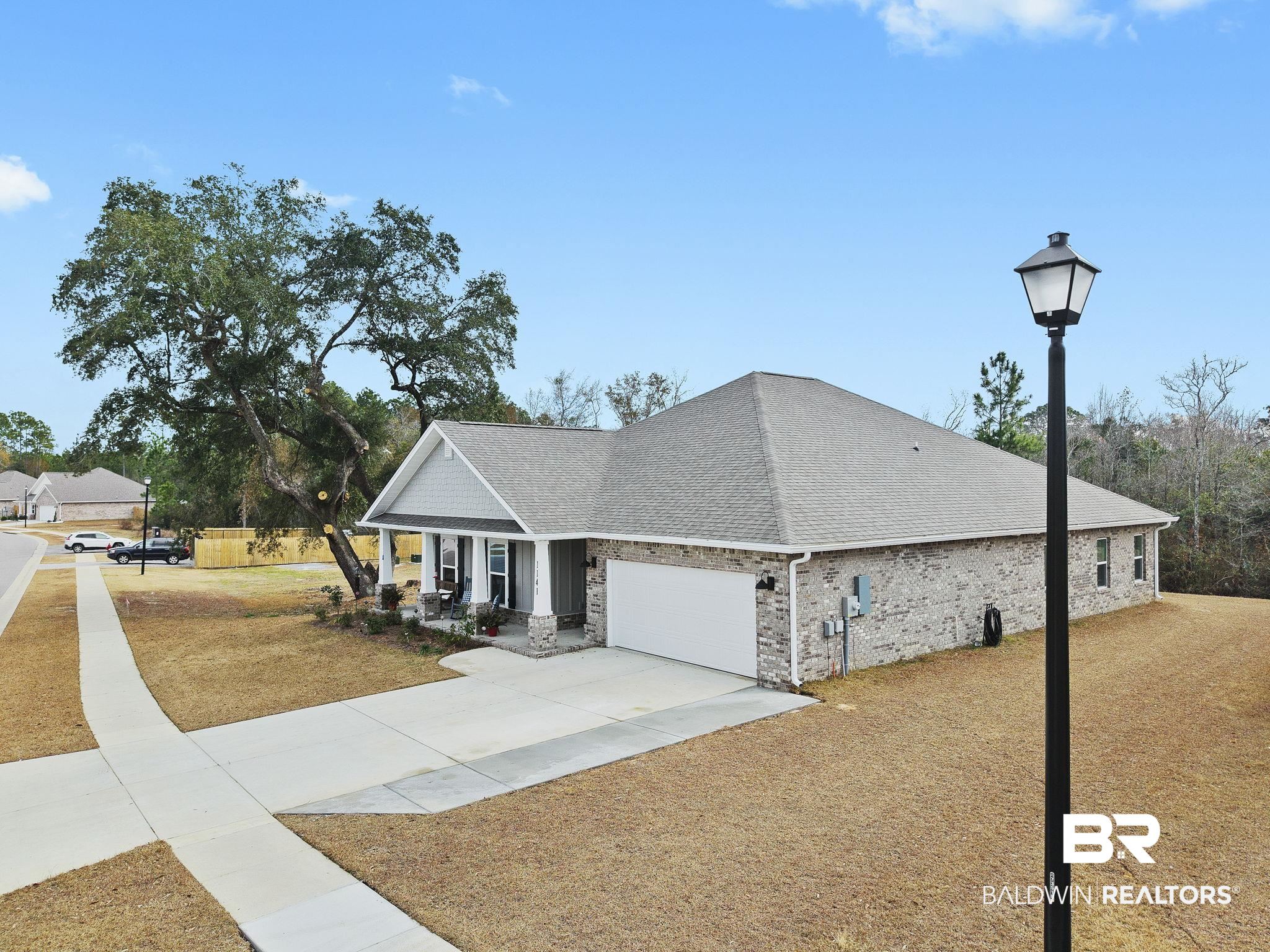 1141 Pencarro Boulevard Foley, AL 36535 - Photo 60 of 70 View of front of home with a garage and covered porch