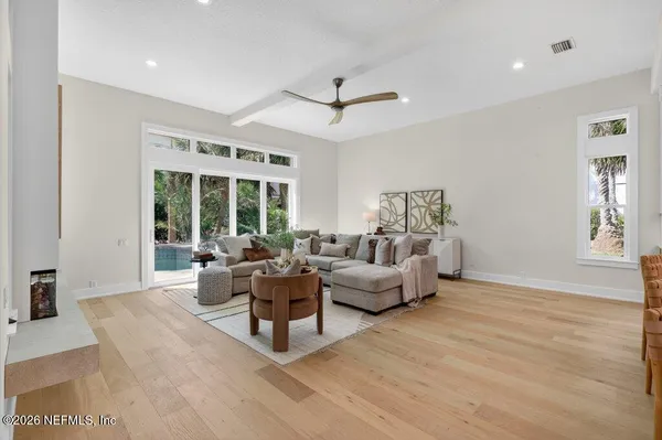 a living room with furniture and a window