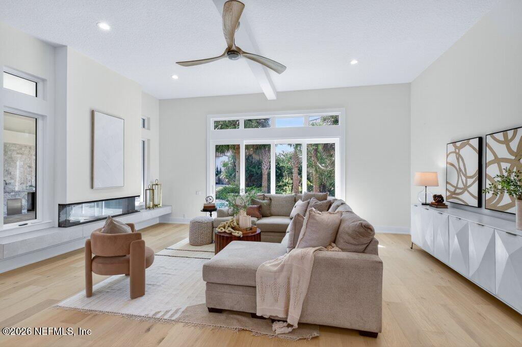 6 Riviera Place Palm Coast, FL 32137 - Photo 27 of 132 a living room with furniture and a large window