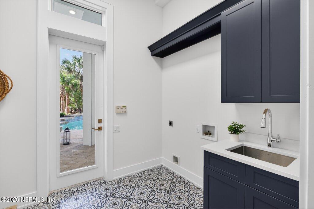 6 Riviera Place Palm Coast, FL 32137 - Photo 46 of 132 a bathroom with a sink and a mirror