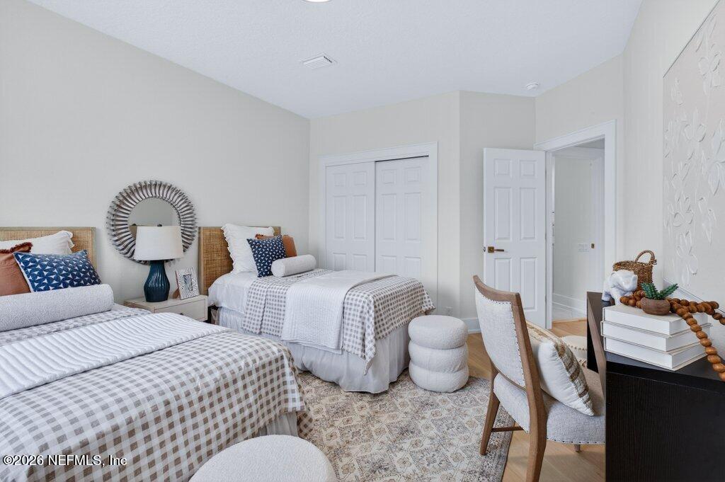 6 Riviera Place Palm Coast, FL 32137 - Photo 61 of 132 a bedroom with two beds and painting on the wall