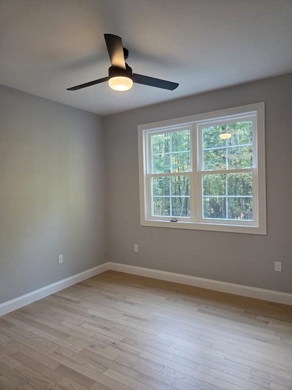 149 Bragg Hill Road Westminster, MA 01473 - Photo 11 of 17 a view of empty room with wooden floor and fan
