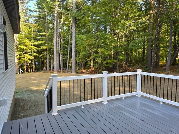 a view of balcony with wooden floor