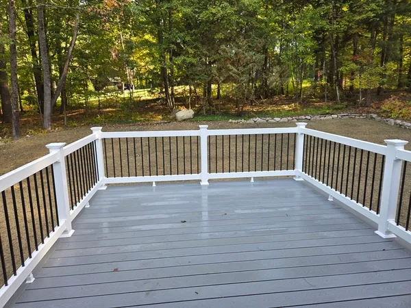 a view of deck with wooden floor and fence