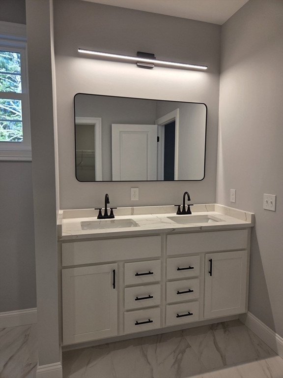 149 Bragg Hill Road Westminster, MA 01473 - Photo 10 of 17 a bathroom with a double vanity sink and mirror