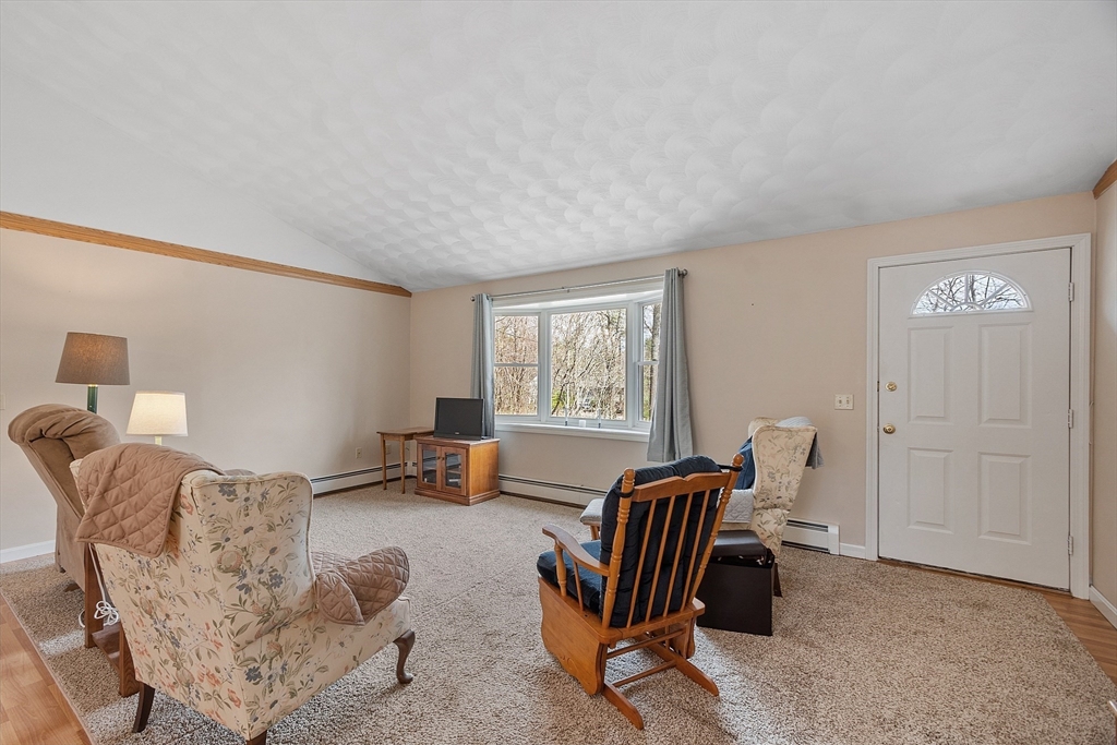 717 Old Petersham Road Barre, MA 01005 - Photo 13 of 40 a living room with furniture and a window