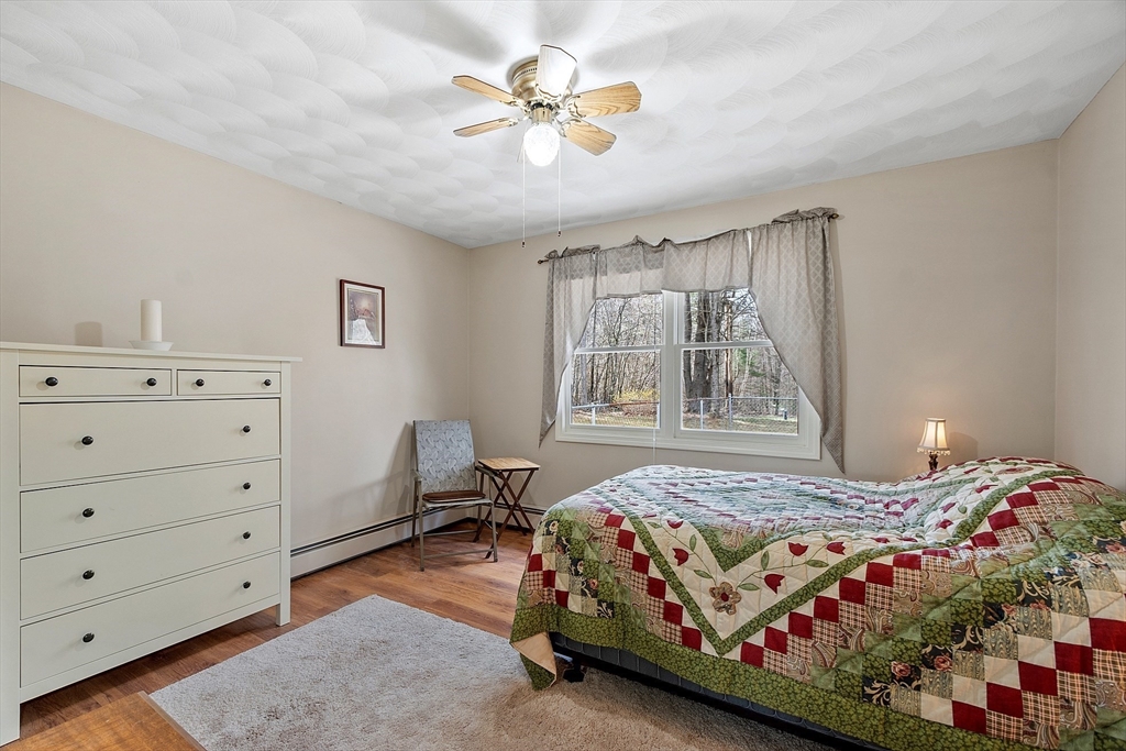 717 Old Petersham Road Barre, MA 01005 - Photo 22 of 40 a bedroom with a bed and a window