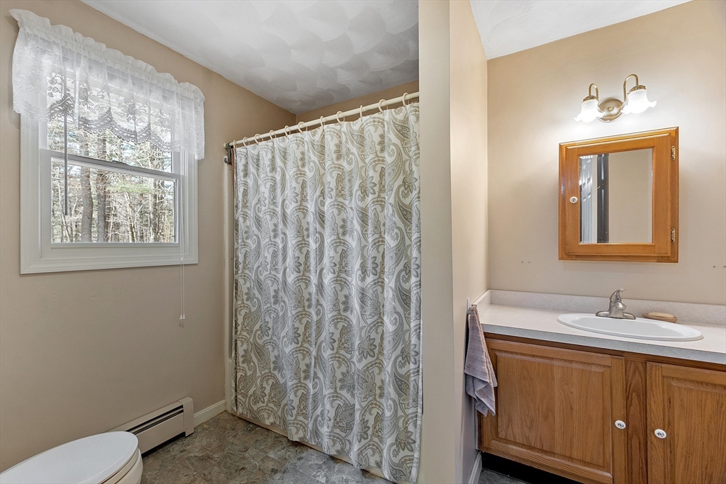 717 Old Petersham Road Barre, MA 01005 - Photo 26 of 40 a bathroom with a sink a toilet and shower