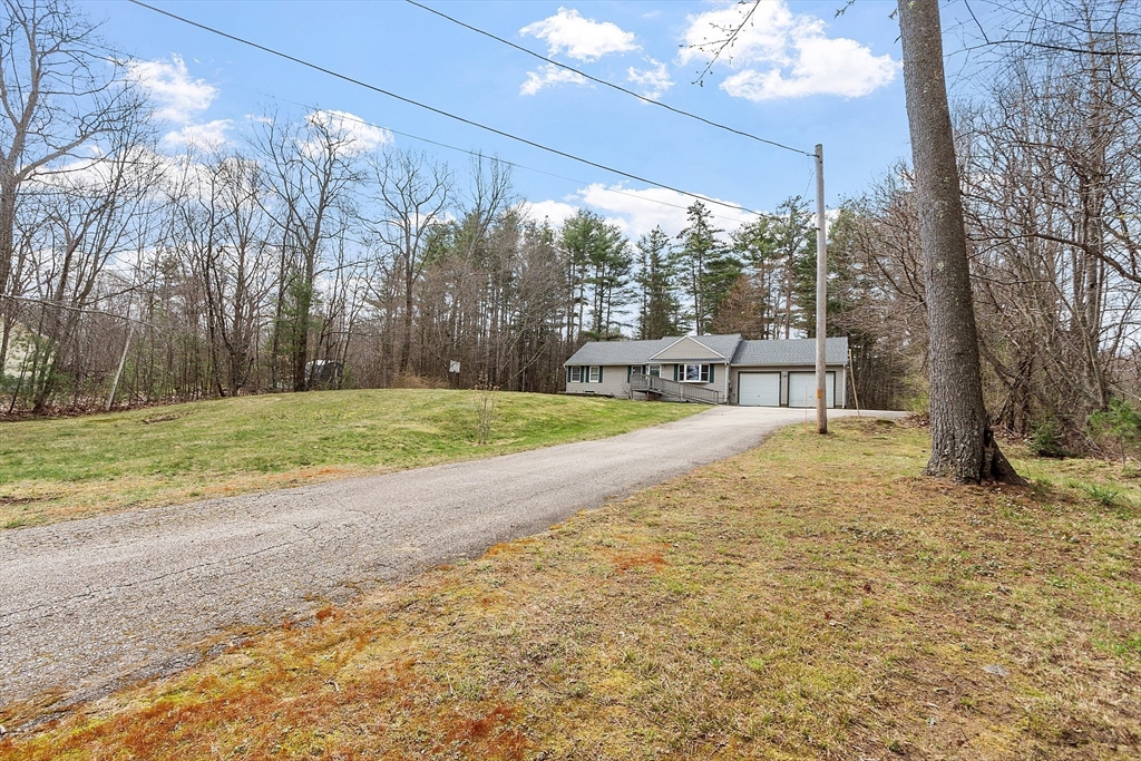 717 Old Petersham Road Barre, MA 01005 - Photo 40 of 40 a view of a house with a yard