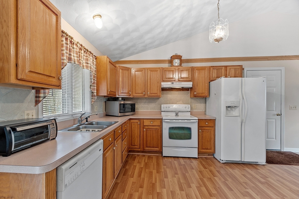 717 Old Petersham Road Barre, MA 01005 - Photo 9 of 40 a kitchen with stainless steel appliances granite countertop a stove a sink dishwasher and a refrigerator