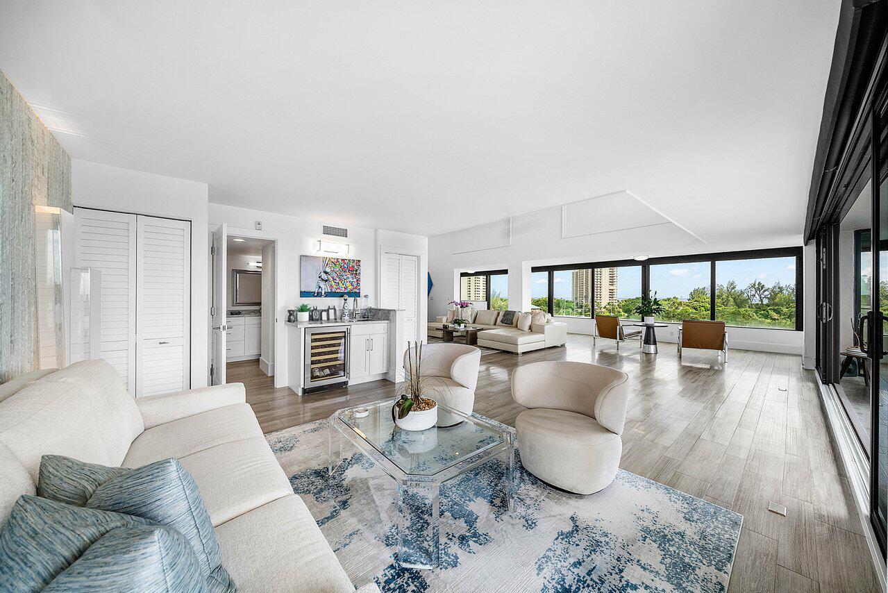 900 Northeast Spanish River Boulevard, Unit 7E Boca Raton, FL 33431 - Photo 15 of 71 a living room with furniture and a large window