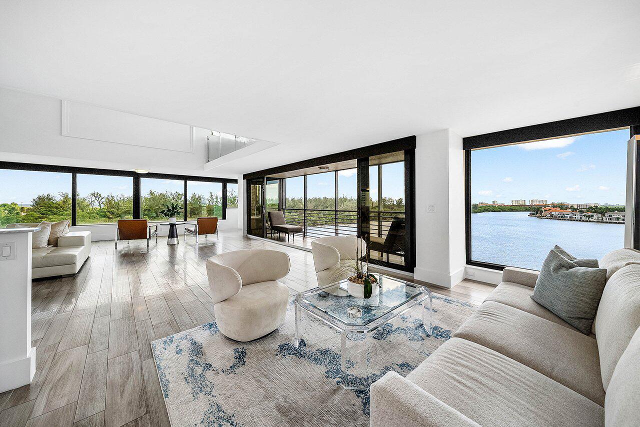 900 Northeast Spanish River Boulevard, Unit 7E Boca Raton, FL 33431 - Photo 16 of 71 a living room with furniture and a large window