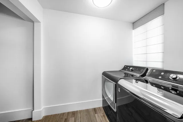 a spacious bedroom with a large bed and a flat screen tv