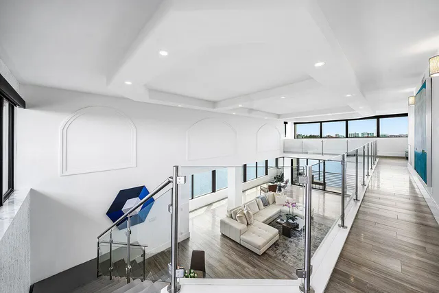 a large bedroom with a bed and a flat screen tv