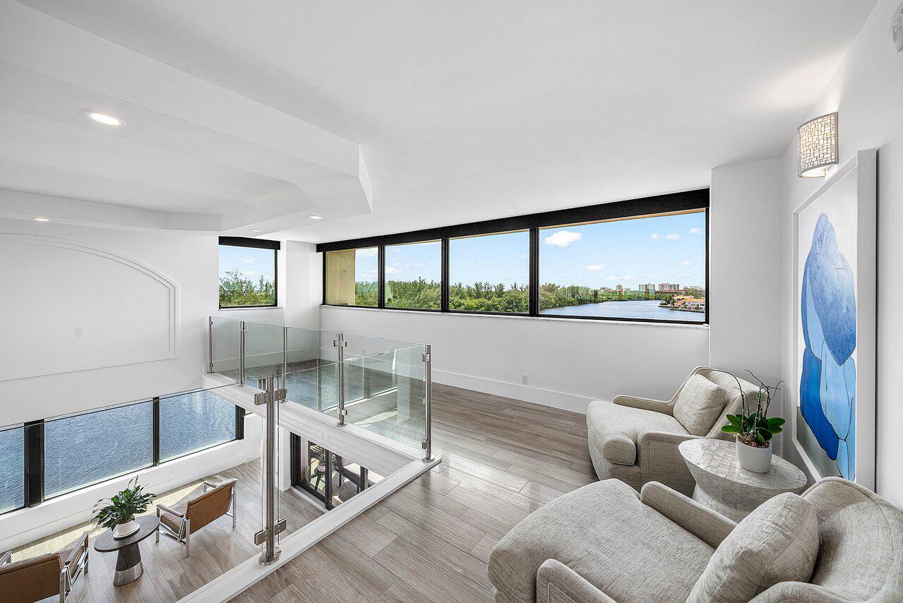 900 Northeast Spanish River Boulevard, Unit 7E Boca Raton, FL 33431 - Photo 28 of 71 a living room with furniture and a large window