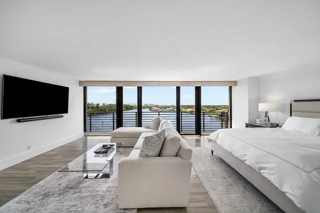 a bathroom with a granite countertop double vanity sink and mirror