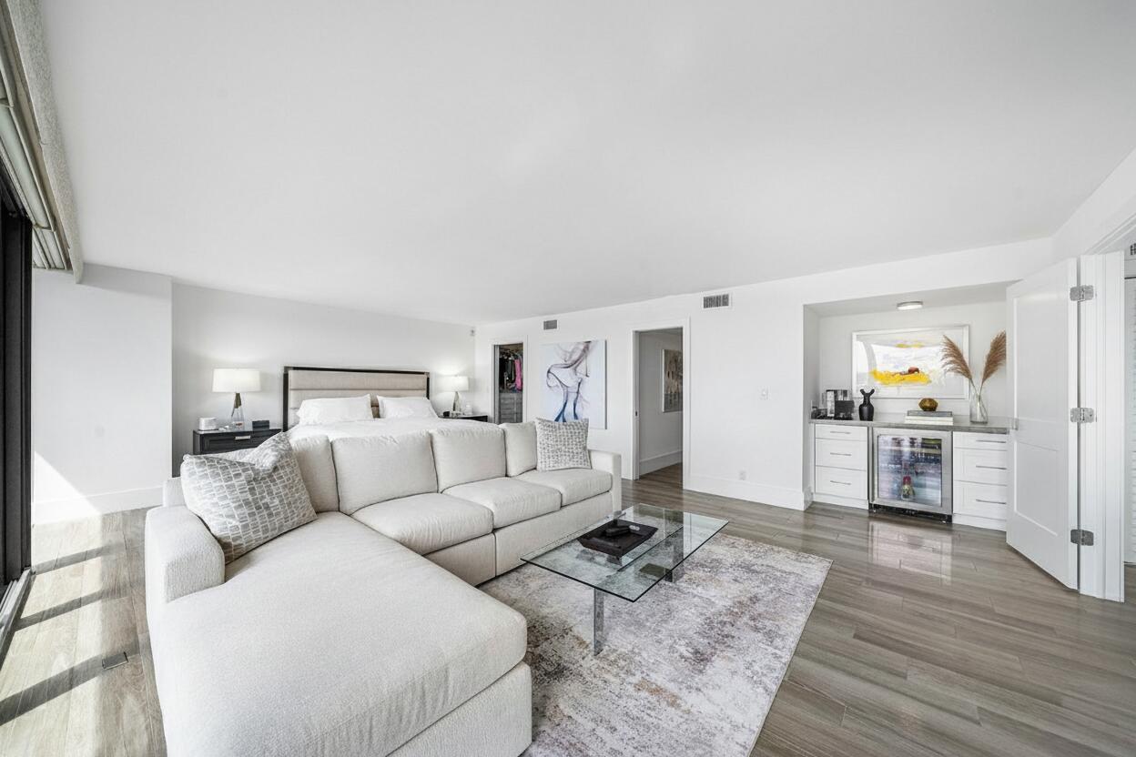 900 Northeast Spanish River Boulevard, Unit 7E Boca Raton, FL 33431 - Photo 35 of 71 a living room with furniture and wooden floor