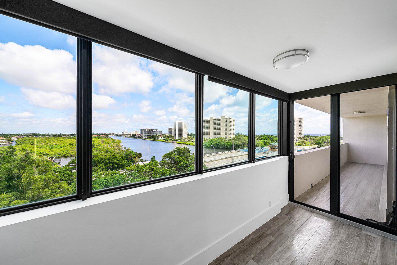 900 Northeast Spanish River Boulevard, Unit 7E Boca Raton, FL 33431 - Photo 47 of 71 a view of a large window with wooden floor in living room