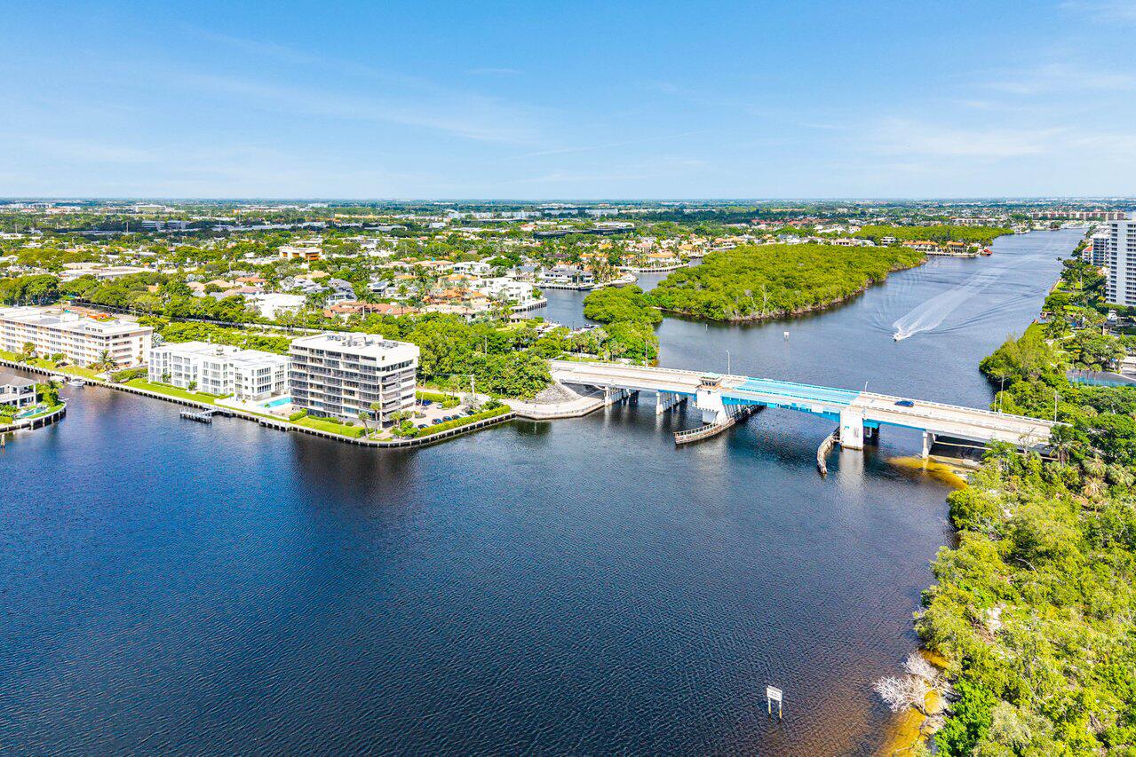 900 Northeast Spanish River Boulevard, Unit 7E Boca Raton, FL 33431 - Photo 62 of 71 an aerial view of a city with lawn chairs