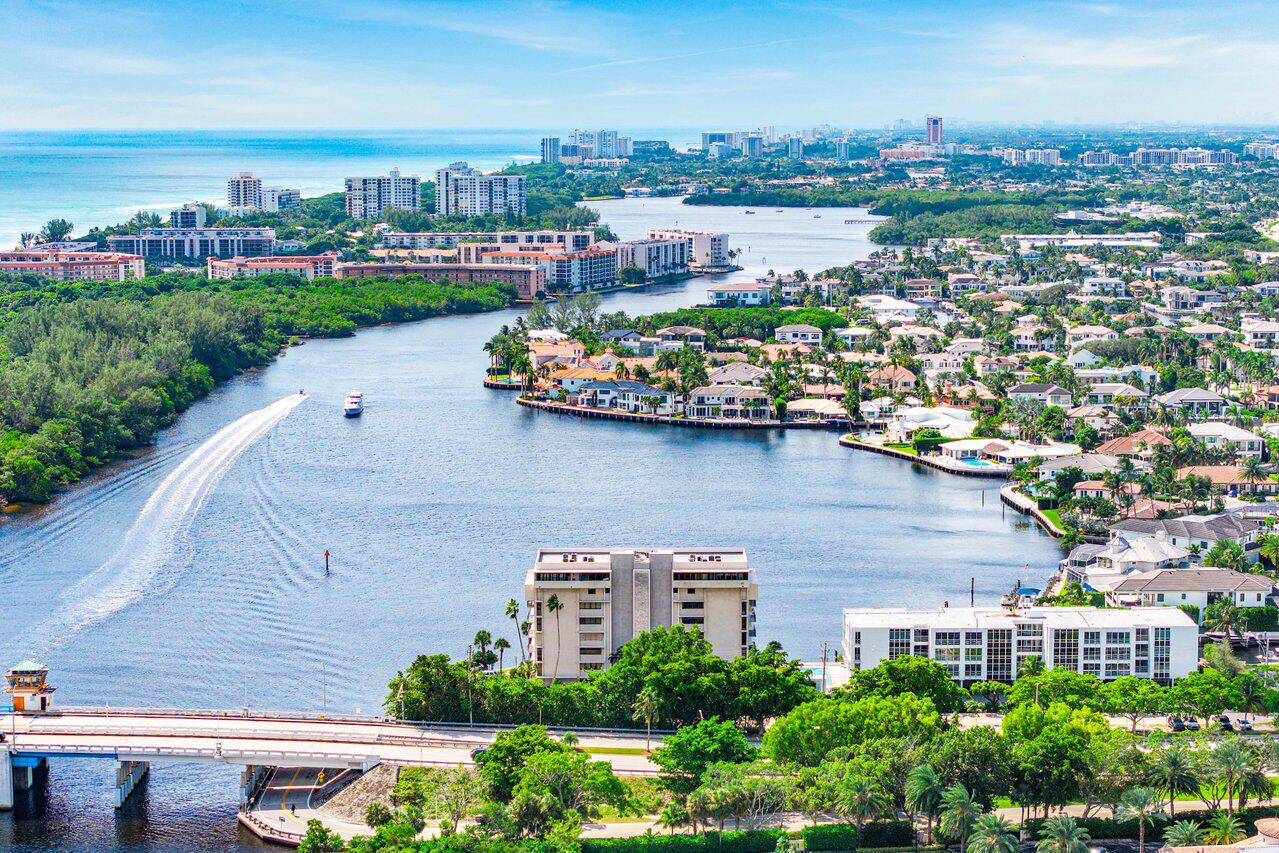 900 Northeast Spanish River Boulevard, Unit 7E Boca Raton, FL 33431 - Photo 66 of 71 an aerial view of a city with lots of residential buildings ocean and mountain view in back