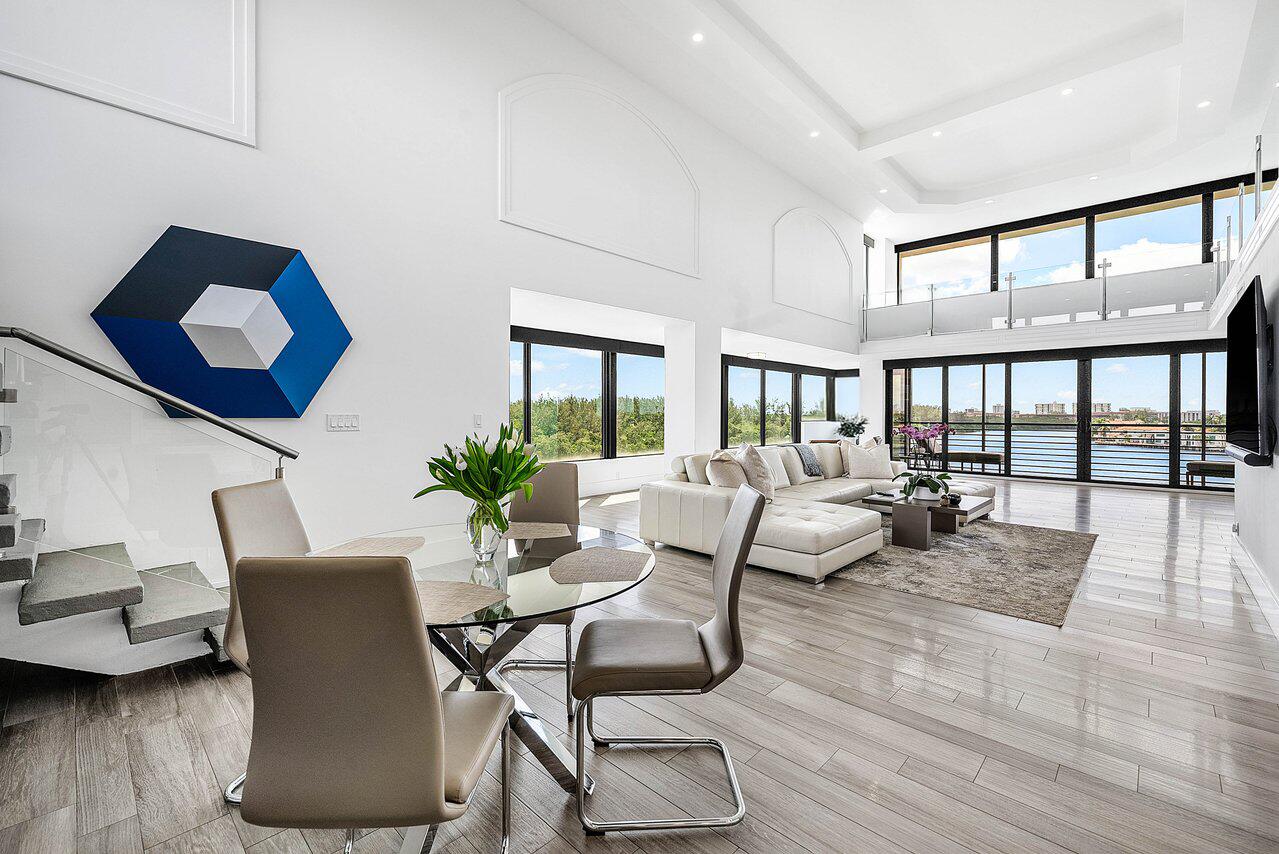900 Northeast Spanish River Boulevard, Unit 7E Boca Raton, FL 33431 - Photo 9 of 71 a living room with furniture and a large window