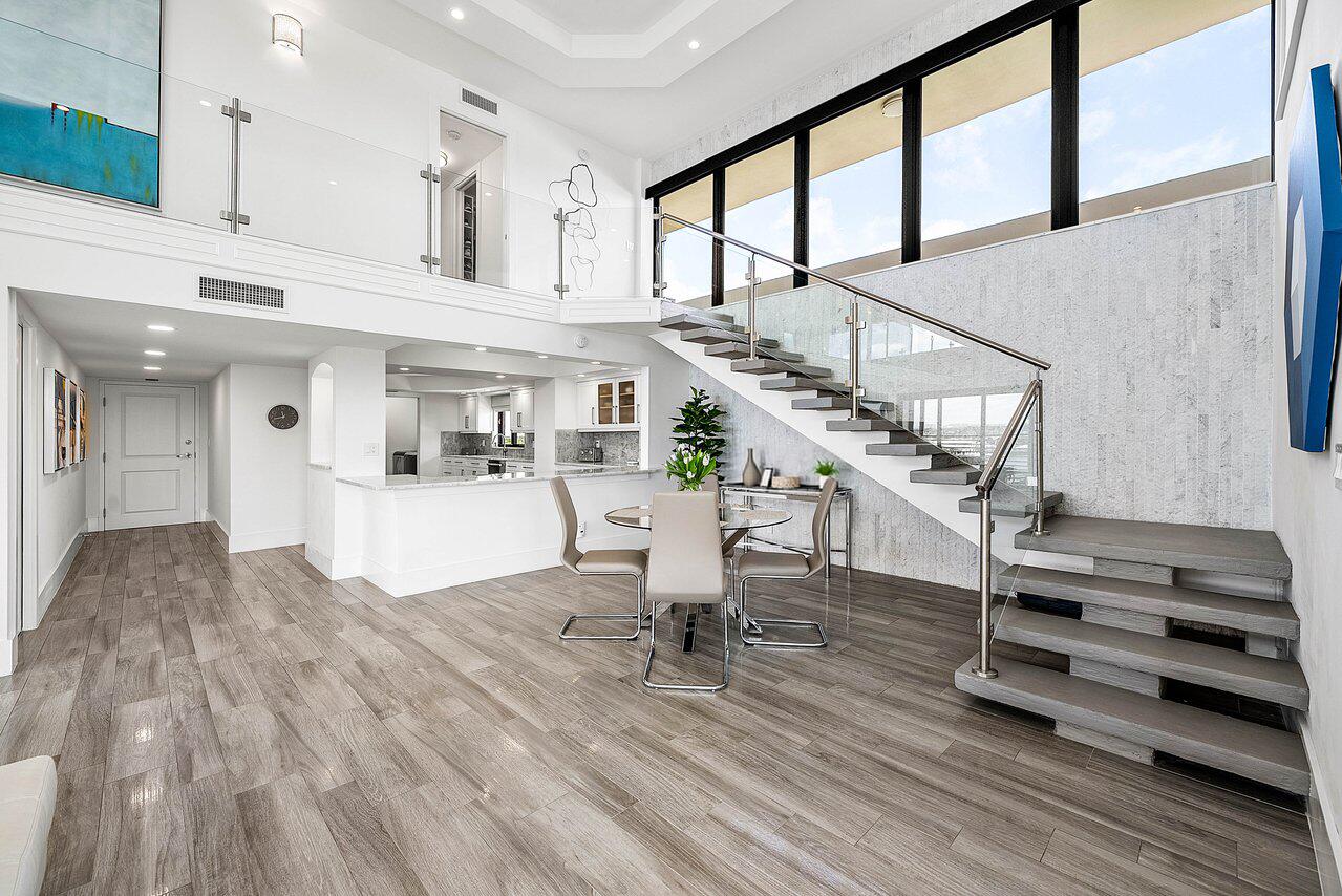 900 Northeast Spanish River Boulevard, Unit 7E Boca Raton, FL 33431 - Photo 10 of 71 a view of entryway and hall with wooden floor