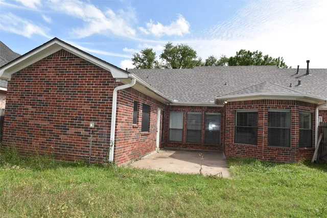 a view of a house with a garden