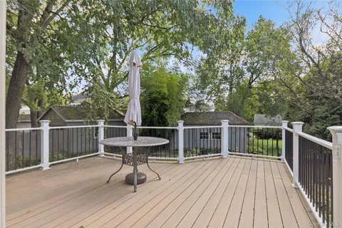 a view of a deck with a table and chairs and wooden floor