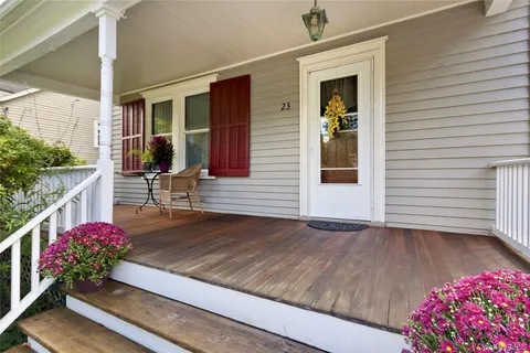 a view of an entryway with wooden floor