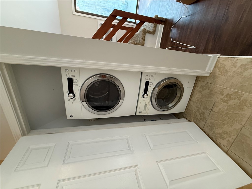 125 Maple Street, Unit 110 Pendleton, SC 29670 - Photo 6 of 18 A neatly tucked-away laundry area with modern front-loading appliances provides convenient utility space.
