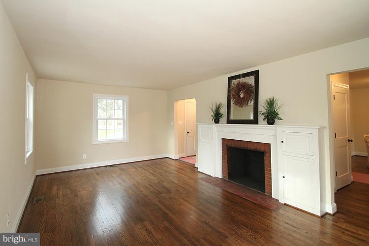 17315 Donora Road Silver Spring, MD 20905 - Photo 19 of 30 Wood burning fireplace and built in shelving